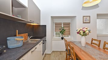 Standard Apartment, 1 Queen Bed with Sofa bed (0360) | Private kitchen | Fridge, microwave, electric kettle
