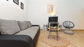 Standard Apartment, 1 Queen Bed with Sofa bed (0360) | Living area | TV