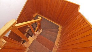 A wooden staircase with a handrail and carpeted steps. - Apartment 1471 (Labin)