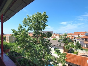 Residential area surrounded by lush greenery and a mix of architectural styles.