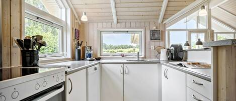 Fridge, stovetop, dishwasher, coffee/tea maker