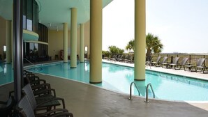 A pool area with lounge chairs and a view of the ocean. - Best seat in the house! FALL RATES, NO CROWDS, RENT A GOLF CART, WALK THE BEACH. (Dauphin Island)