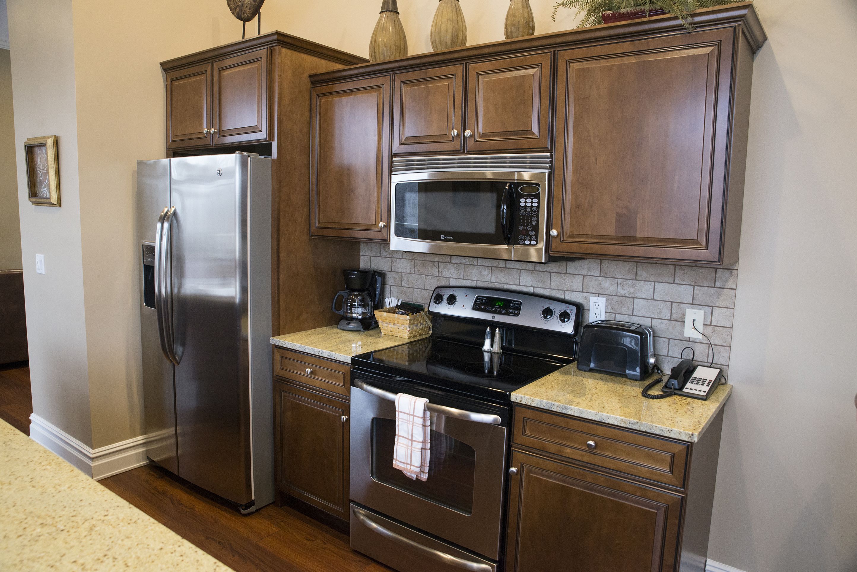 luxury condo, multiple beds, river view | private kitchen | fridge, microwave