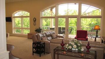 Luxury Condo, Multiple Beds, River View | Living area | Smart TV