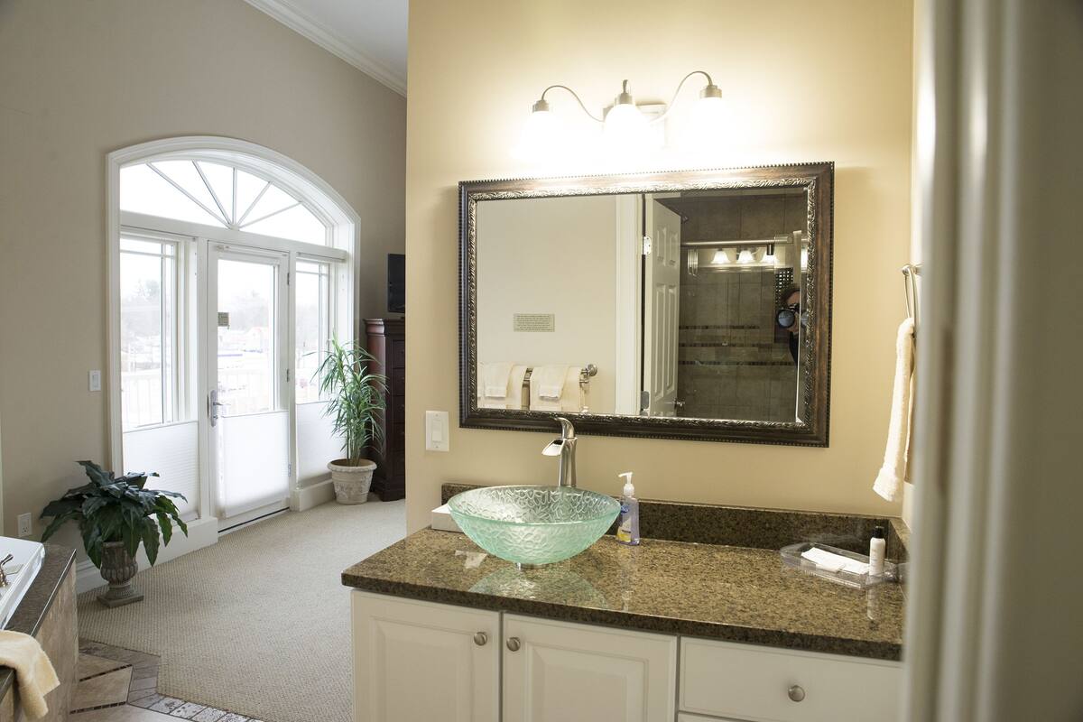 luxury condo, multiple beds, river view | bathroom | hair dryer, towels