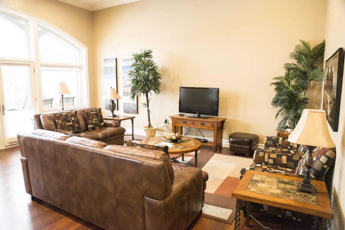 Luxury Condo, Multiple Beds, River View | Living area | Smart TV