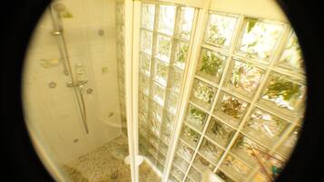 Bathtub, eco-friendly toiletries, hair dryer, towels