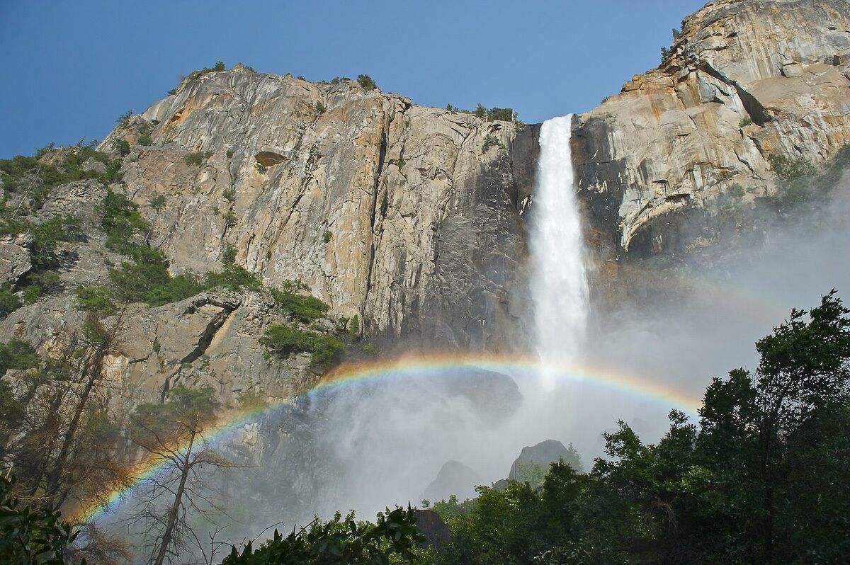 A waterfall with a rainbow.