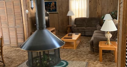 Cozy vacation home nestled in a quiet wooded area. Near town but private