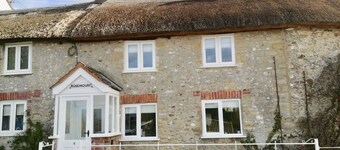 Beautiful thatched country cottage, quiet countryside position .