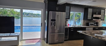 Spacious Modern Waterfront Lake Home with Heated Pool / 15 min Drive to Beach!