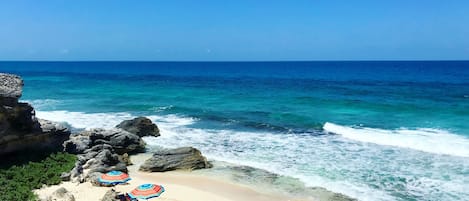 On the beach, sun loungers, beach towels