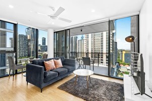 1 Bedroom Apartment | Living area | 50-inch flat-screen TV with digital channels, TV
