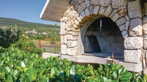A stone-built outdoor oven with a view of a rural landscape. - Lovely home in Donji Prolozac with sauna (Donji Prolozac)