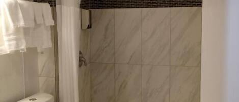 Separate tub and shower, towels