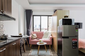 Basic Studio, Balcony | Living area | LED TV - Sazi Kim Ma Thuong Building (Hanoi)