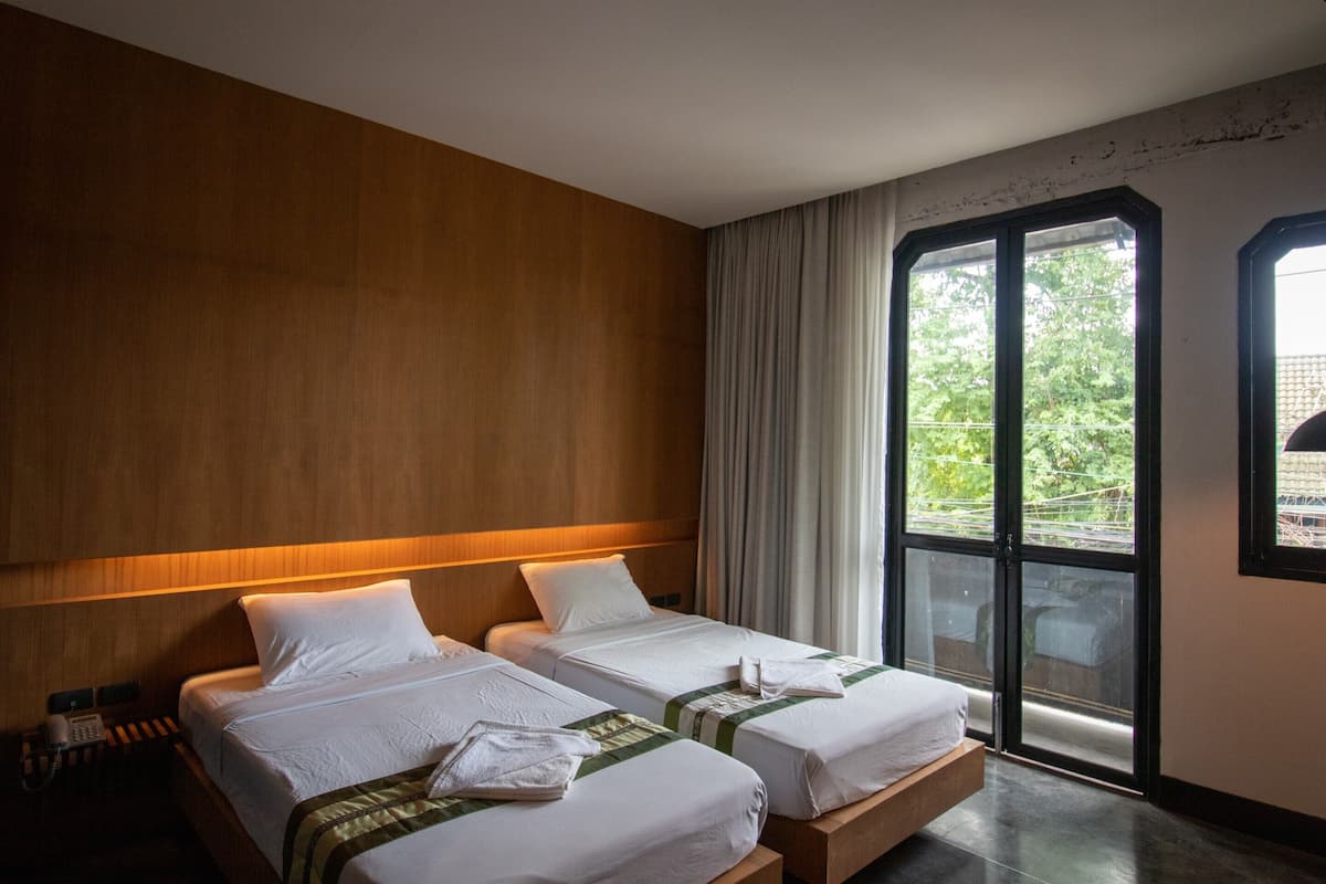 Habitación Deluxe con 2 camas individuales | Wifi gratis y ropa de cama 