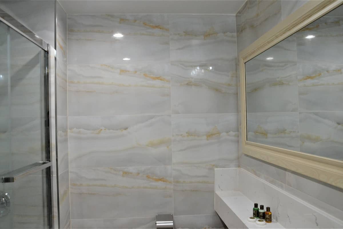 deep-soaking bathtub, rainfall showerhead, free toiletries, hair dryer