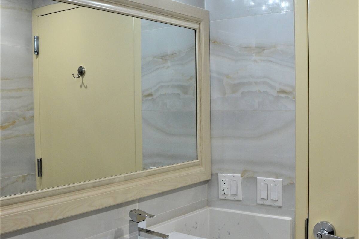 deep-soaking bathtub, rainfall showerhead, free toiletries, hair dryer