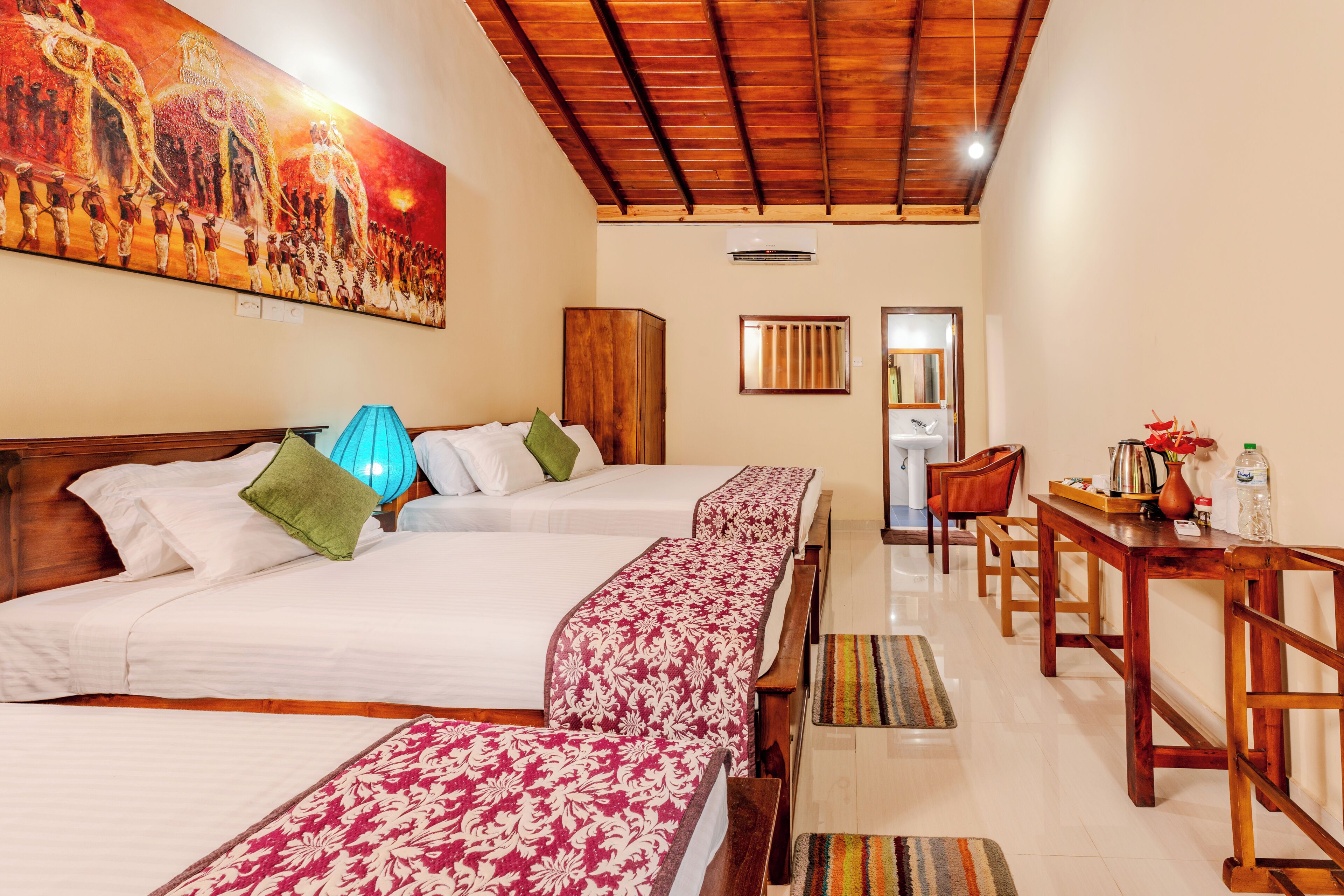 Deluxe Triple Room, Garden View | Rollaway beds, bed sheets