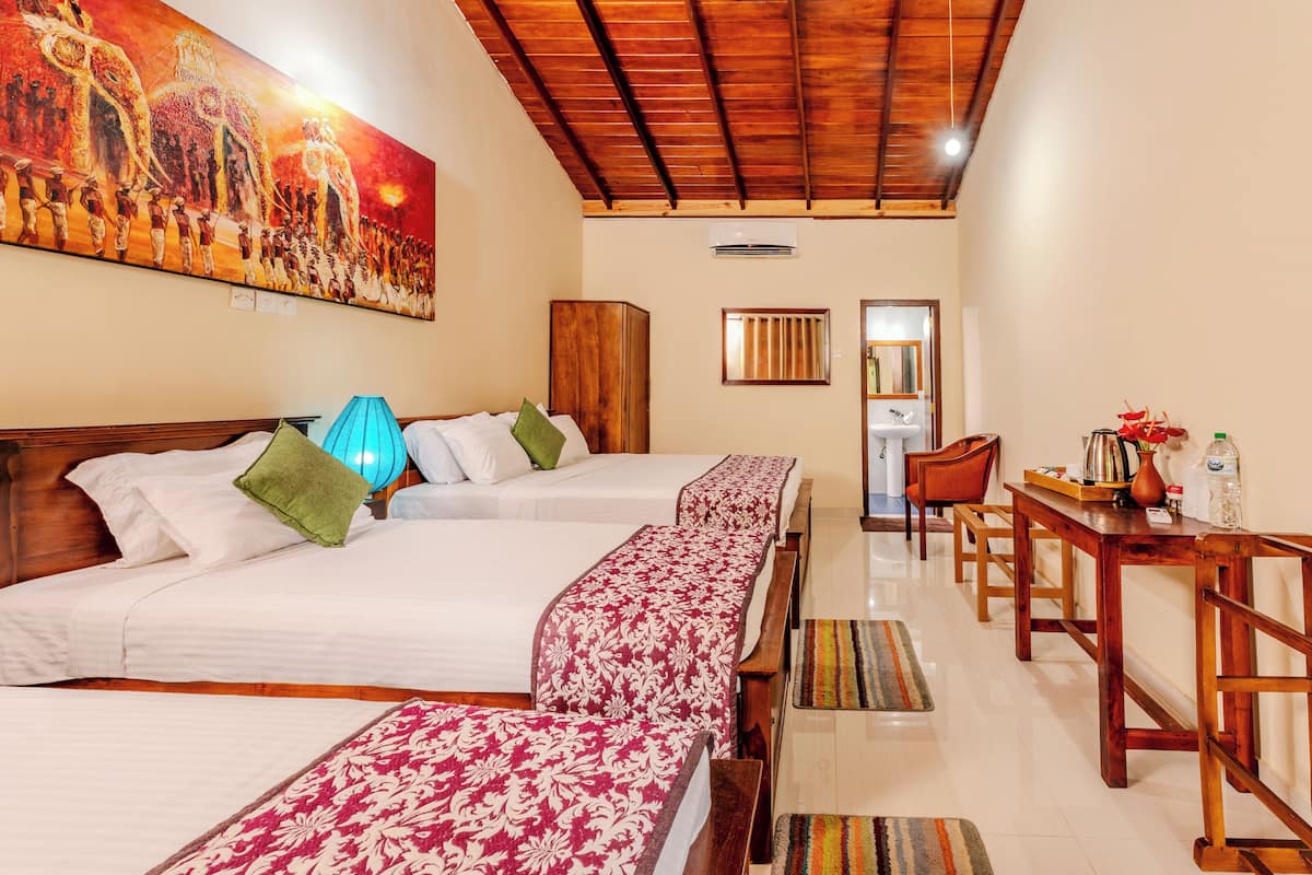 Deluxe Triple Room, Garden View | Bed sheets