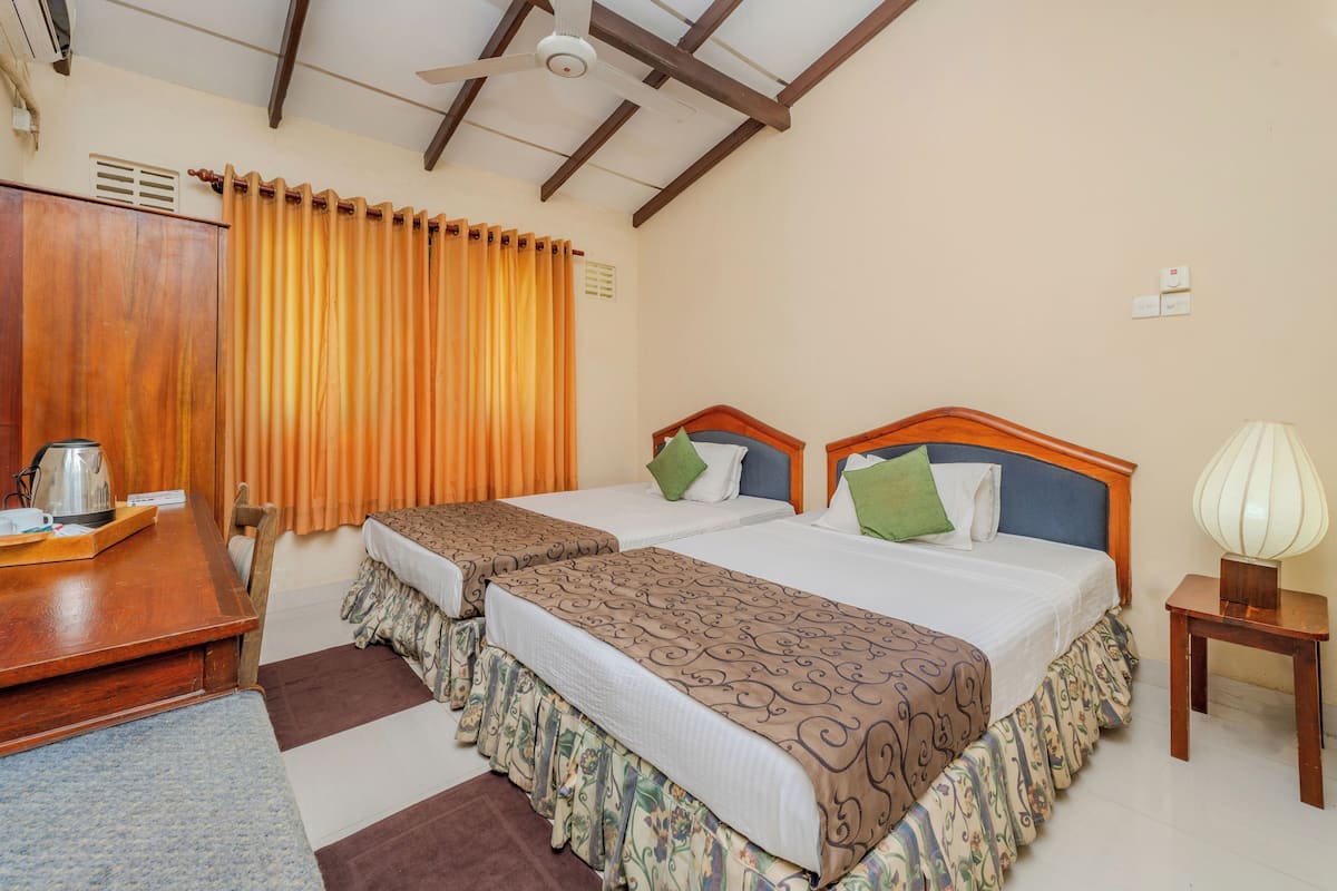 Standard Quadruple Room, Garden View | Bed sheets