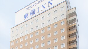 A hotel building with a sign that reads "toyako-inn.com" and "TOYAKO INN" in English and Japanese. - Toyoko Inn Akabane Station Higashi (Tokyo)
