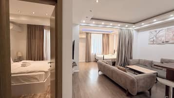 Superior Apartment, Balcony | Living area | Flat-screen TV