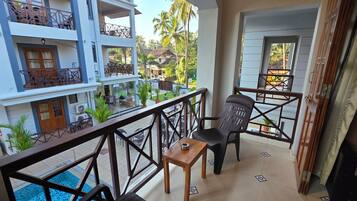Apartment with Pool View | Memory-foam beds, in-room safe, laptop workspace, blackout curtains