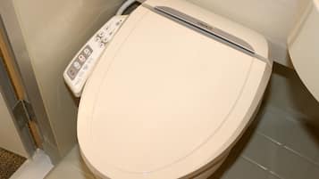 A toilet with a control panel featuring various buttons and a brand name.