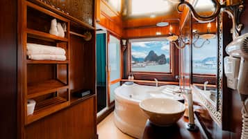 Separate tub and shower, jetted tub, free toiletries, hair dryer