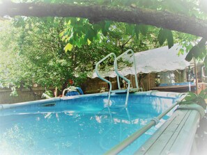 Indoor pool, seasonal outdoor pool, pool umbrellas, pool loungers