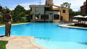 Outdoor pool, open 7:00 AM to 6:00 PM, pool umbrellas, sun loungers