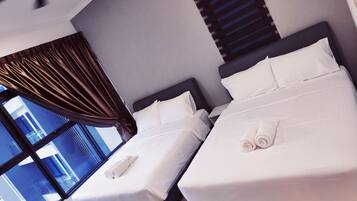 Departamento superior, varias camas | Tabla de planchar con plancha, wifi gratis y ropa de cama