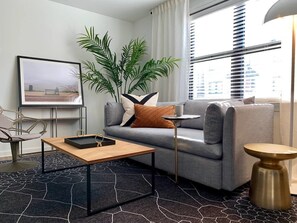 42-inch flat-screen TV with cable channels, TV, streaming services - Abode Nashville - Marathon Village Near Downtown (Nashville)