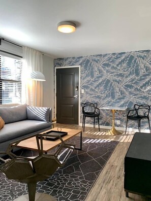 42-inch flat-screen TV with cable channels, TV, streaming services - Abode Nashville - Marathon Village Near Downtown (Nashville)