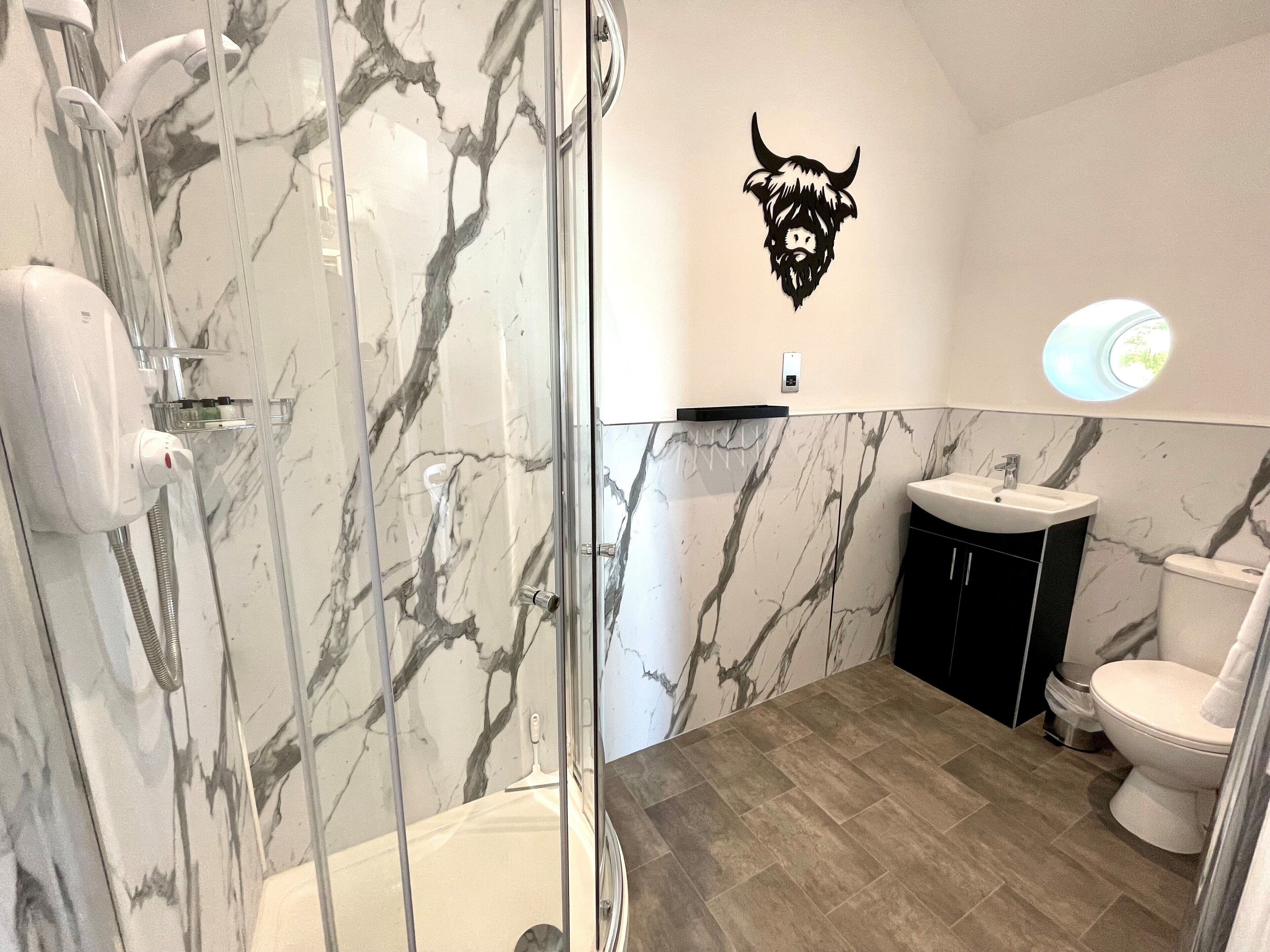luxury studio suite | bathroom | free toiletries, hair dryer, towels, soap