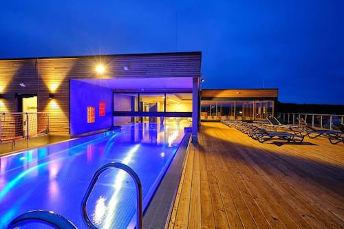 Indoor pool, outdoor pool, pool umbrellas, pool loungers