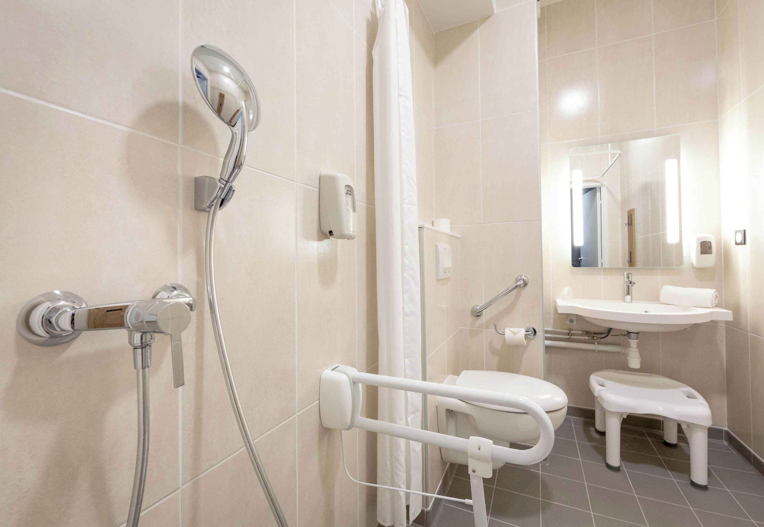 double room, mobility accessible | bathroom | shower, towels, soap, toilet paper
