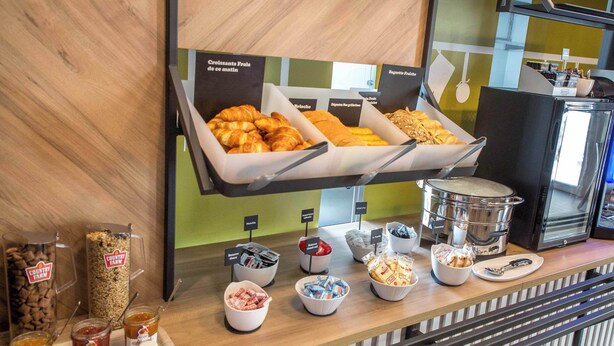A breakfast buffet with various food items and condiments. - B&B HOTEL SAINTE MAXIME Golfe de St Tropez (4628) (Sainte-Maxime)