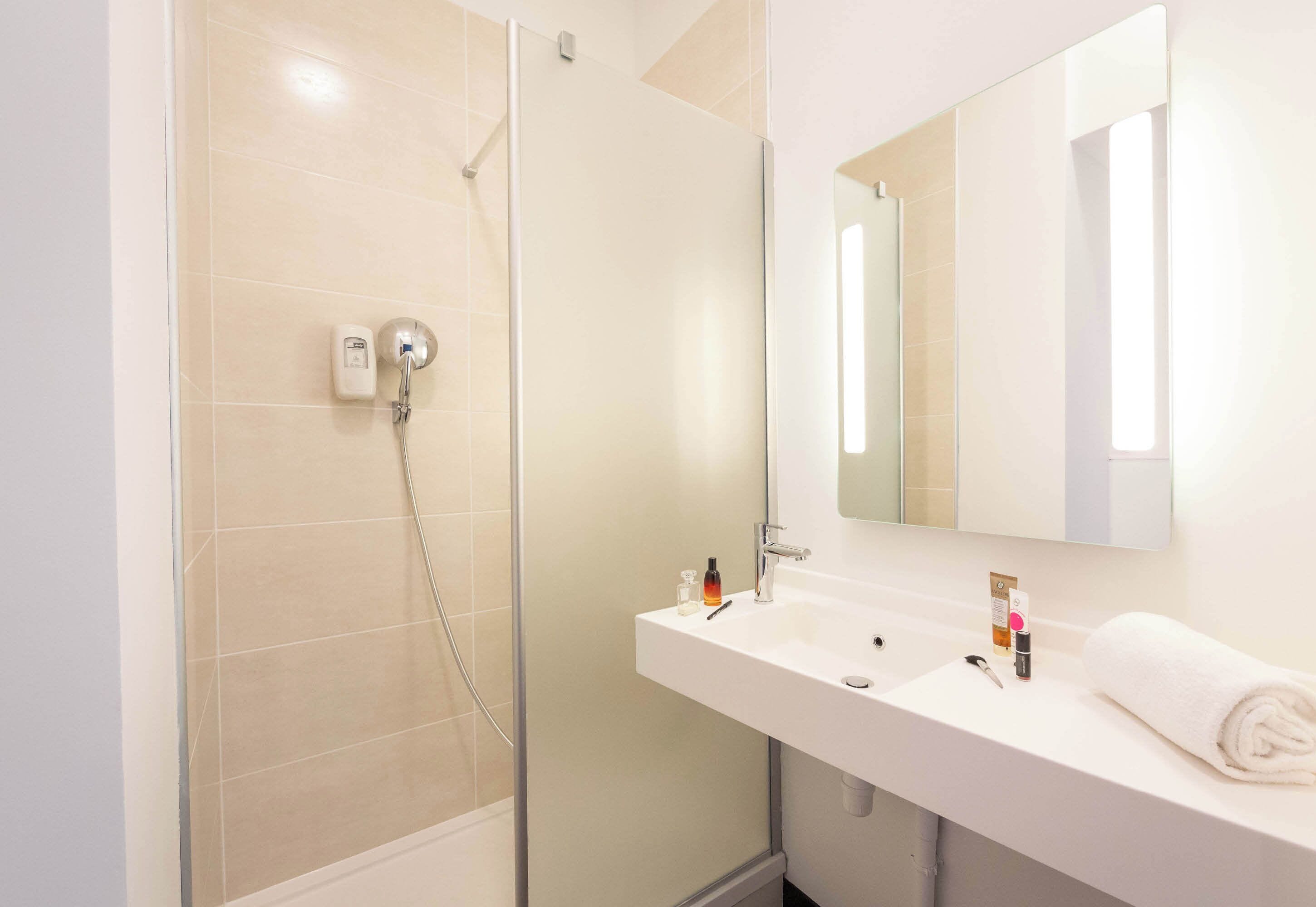 shower, towels, soap, toilet paper