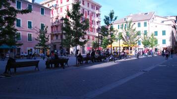A public square with benches and people.