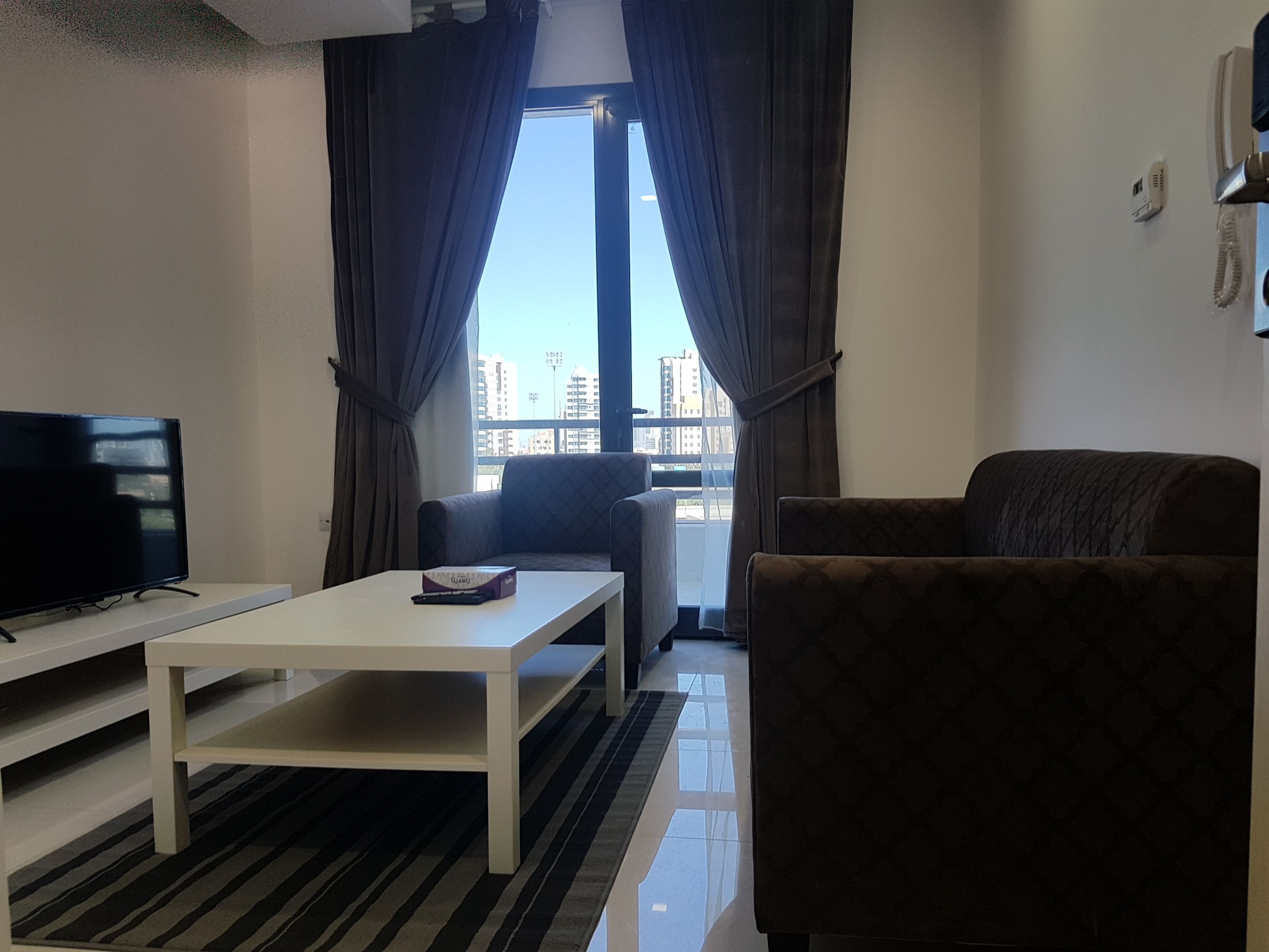 42-inch flat-screen TV with satellite channels, TV
