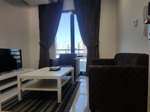 42-inch flat-screen TV with satellite channels, TV - Magic Suite Boulevard Salmiya (Salmiya)