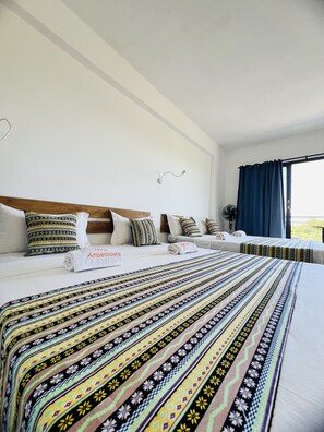 Family Room, Multiple Beds, Mountain View | In-room safe, desk, laptop workspace, soundproofing - Hotel Ambatoloaka (Nosy Be)
