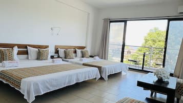 Family Room, Multiple Beds, Beach View | 1 bedroom, in-room safe, desk, laptop workspace