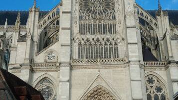 A large cathedral with intricate Gothic architecture, including pointed arches and detailed stone carvings.