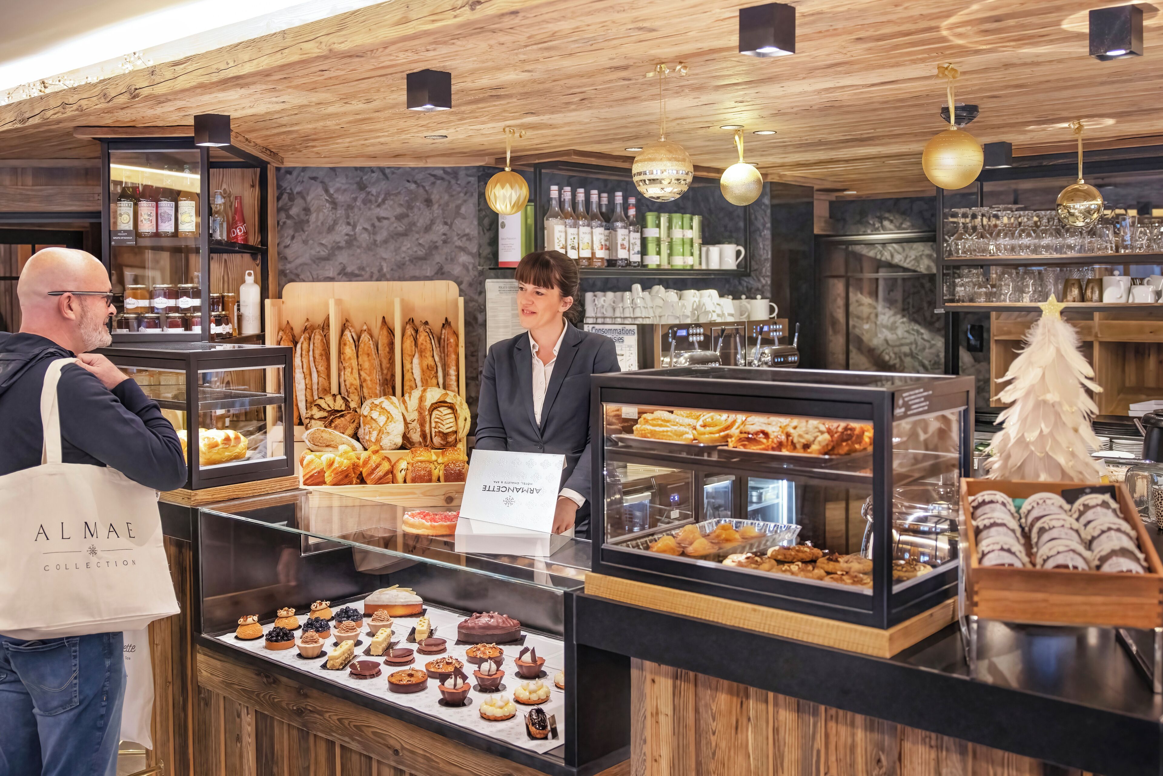 A bakery counter with various pastries and desserts displayed in glass cases.