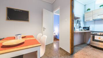 Family Apartment, 2 Bedrooms | Private kitchen | Fridge, microwave, oven, stovetop