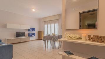Apartment, 1 Bedroom | Living area | TV